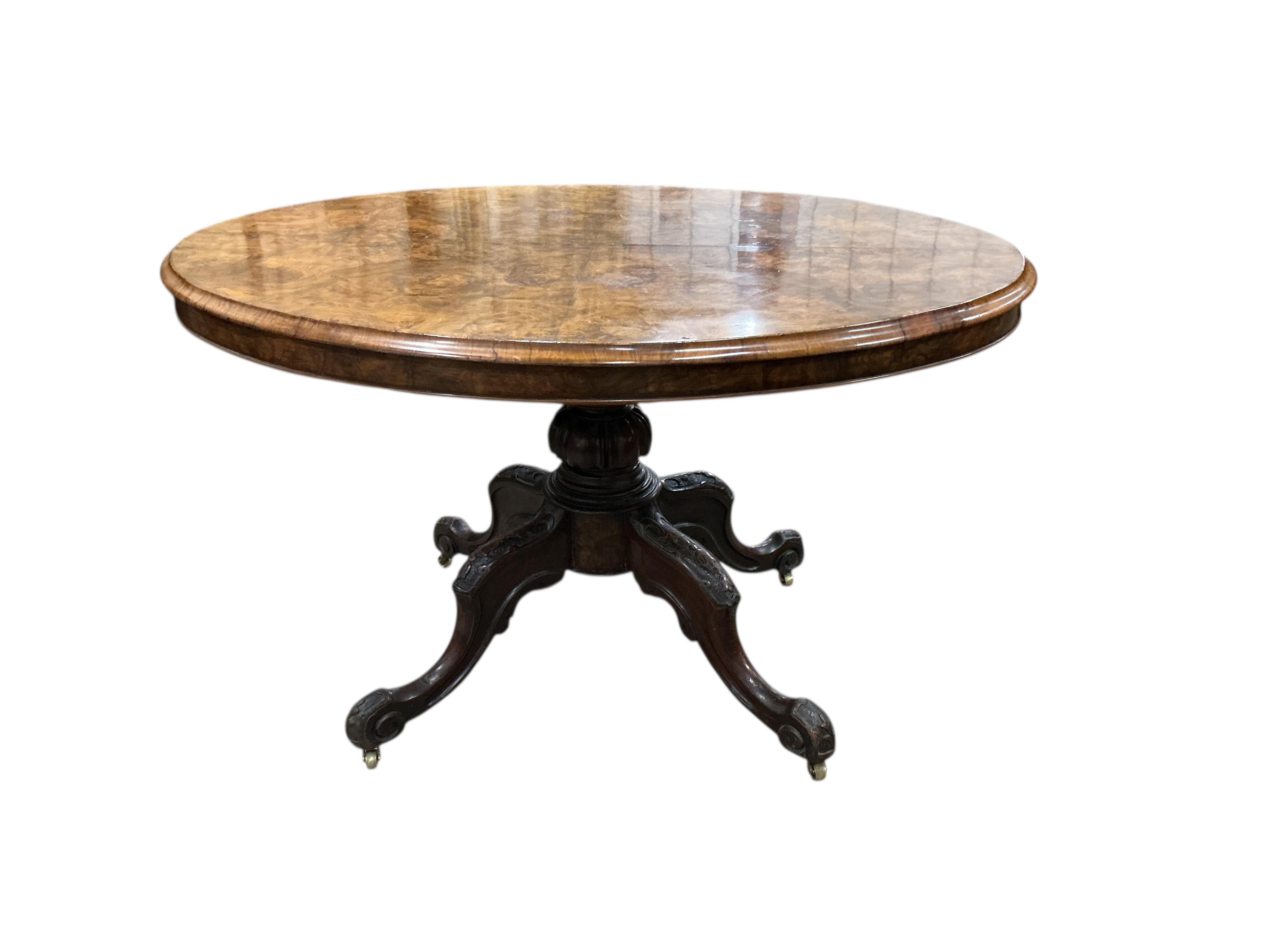 A Victorian figured walnut oval tilt top loo table, width 84cm, depth 122cm, height 72cm